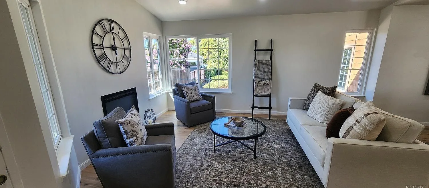 Staged living room with a fireplace